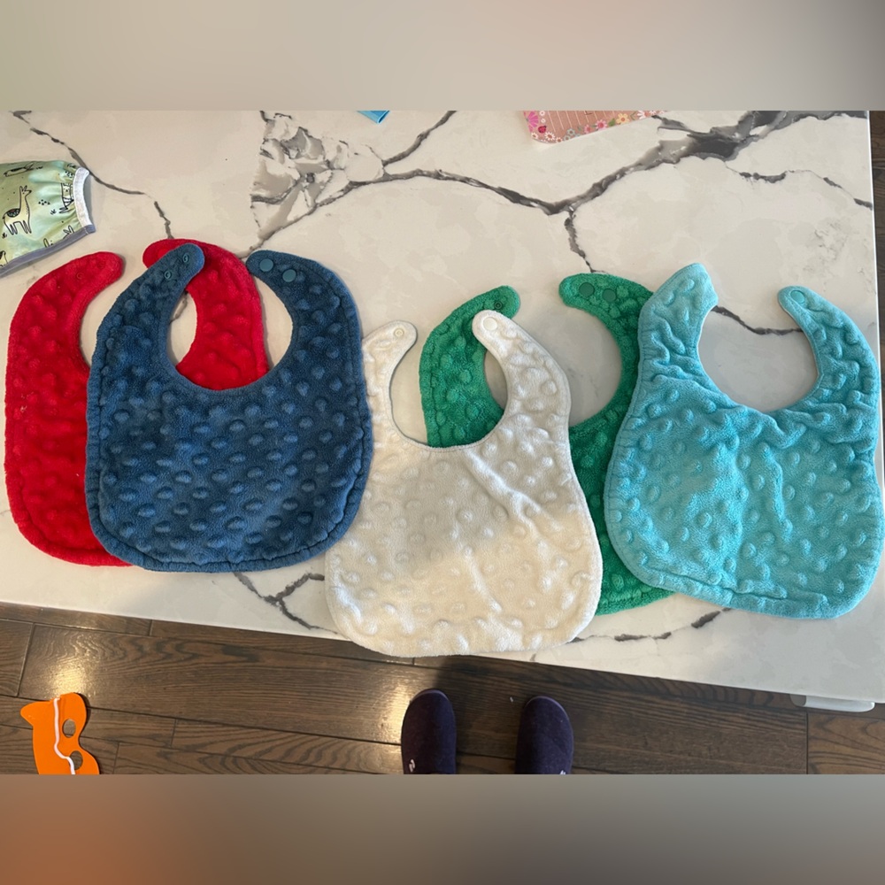 Set of four bibs
